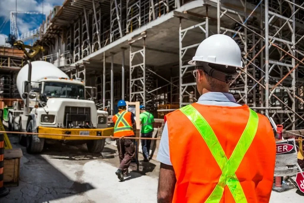 Construction team overseeing a concrete Blackburn delivery at a commercial site.